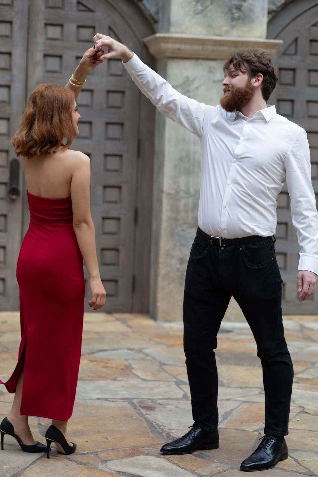 Couple dancing, the woman in a red dress, photographed by Kamar photography